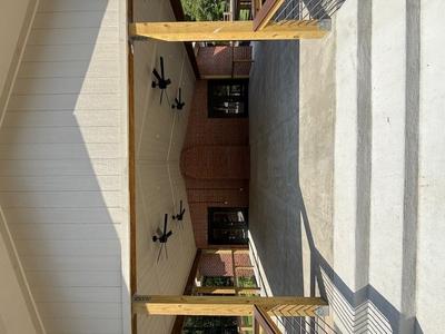 Outdoor Patio Space with Outdoor Fans, Surrounded by Beautiful Black Side Railings